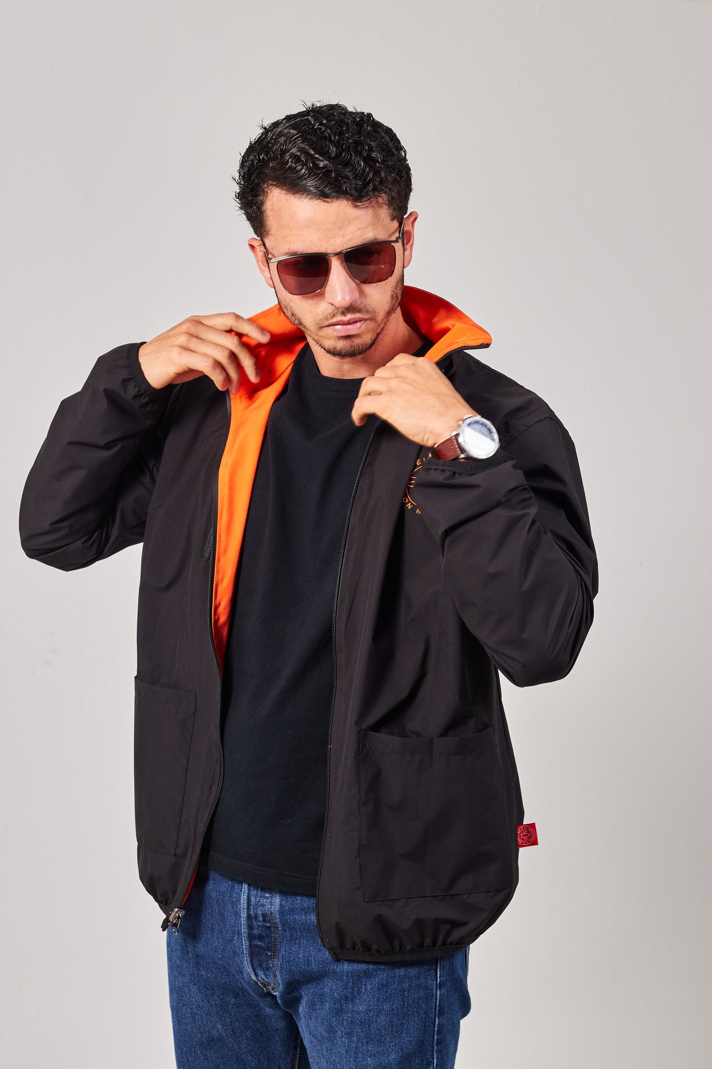 Windbreaker weatherproof negro/naranja aviación